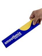 Hand holding a roll of smoothmix 9 inch jumbo rolling papers pack against a white background