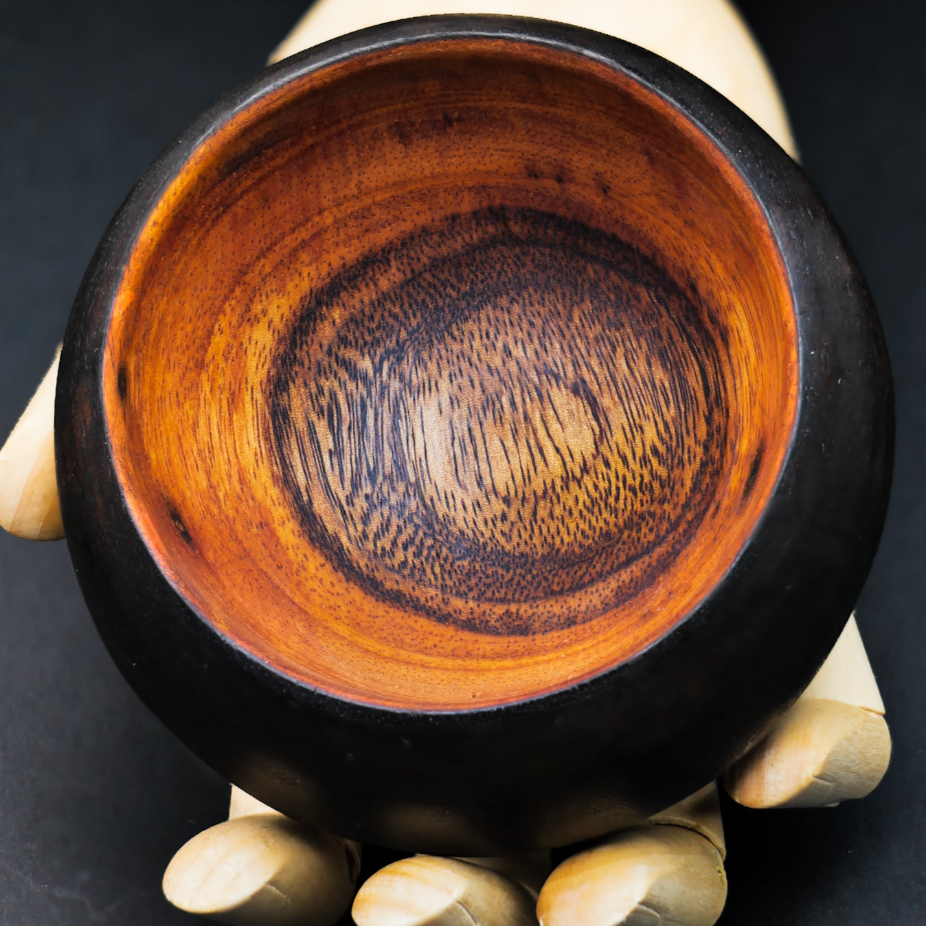 hand holding a smoothmix Cannabowl Mini herbal blend mixing bowl with distinct grain pattern