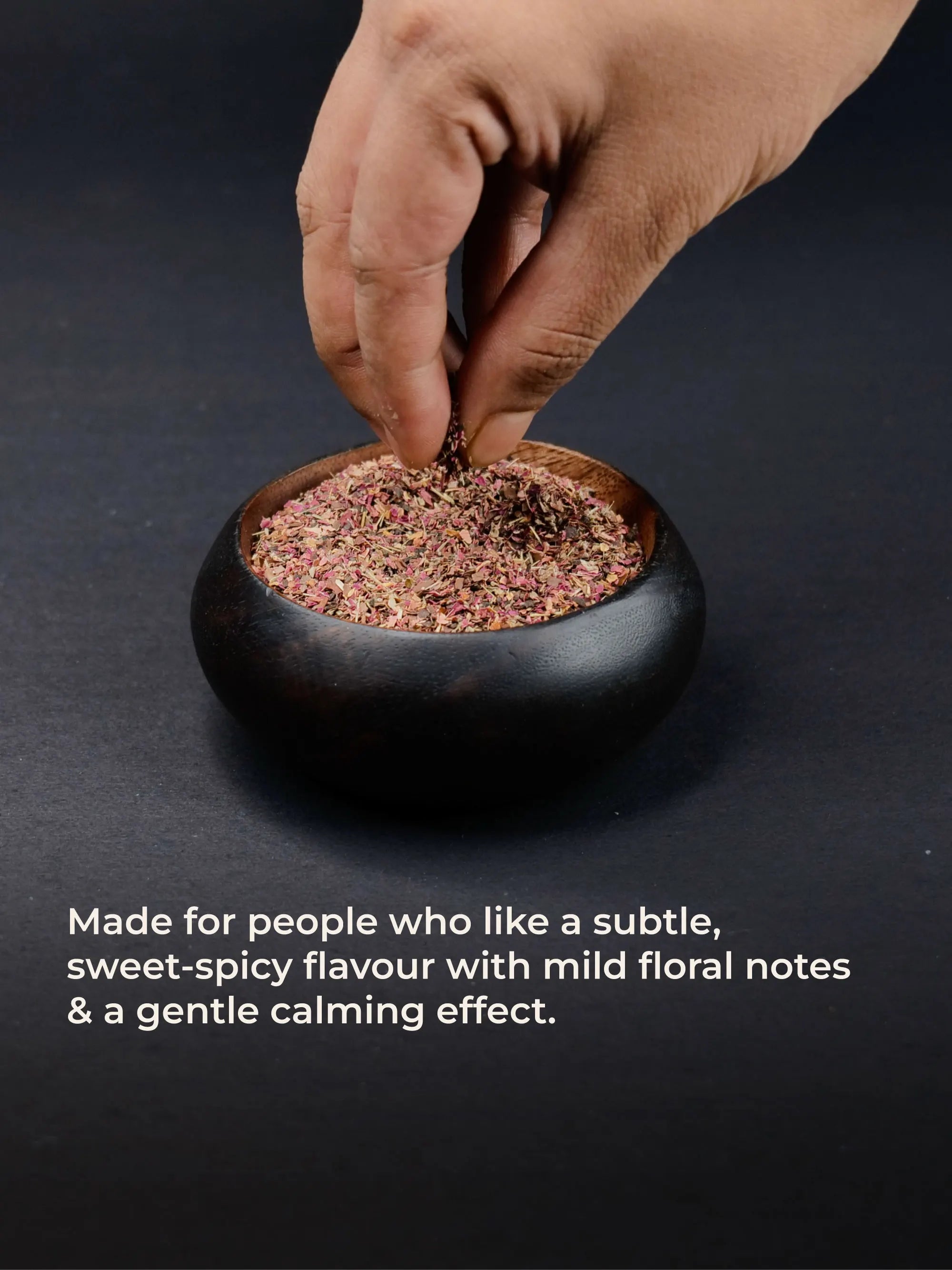 Hand dipping in a bowl of smoothmix herbal smoking blend 